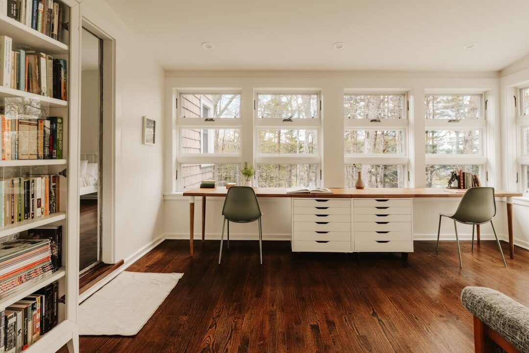 Elegant home library and office with wooden shelves and a vintage desk