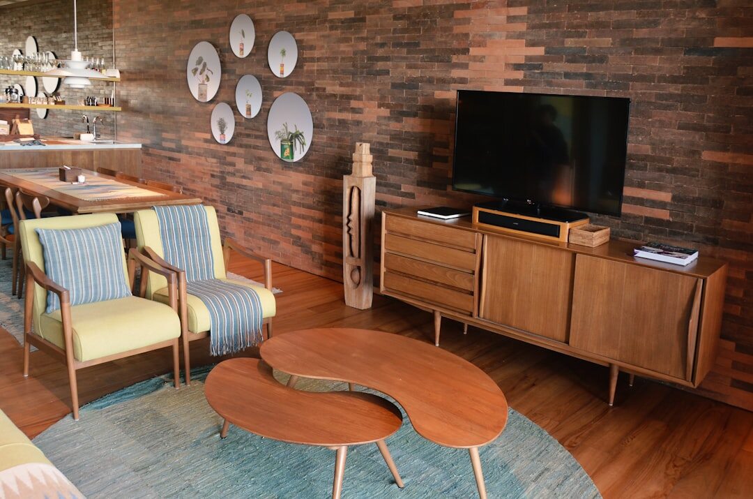 Vintage 1980s living room with bold patterned wallpaper and retro furniture